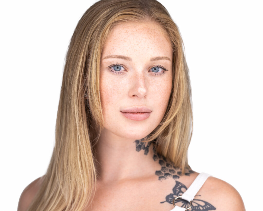 Modeling Headshot of a Young Woman with a neck tattoo