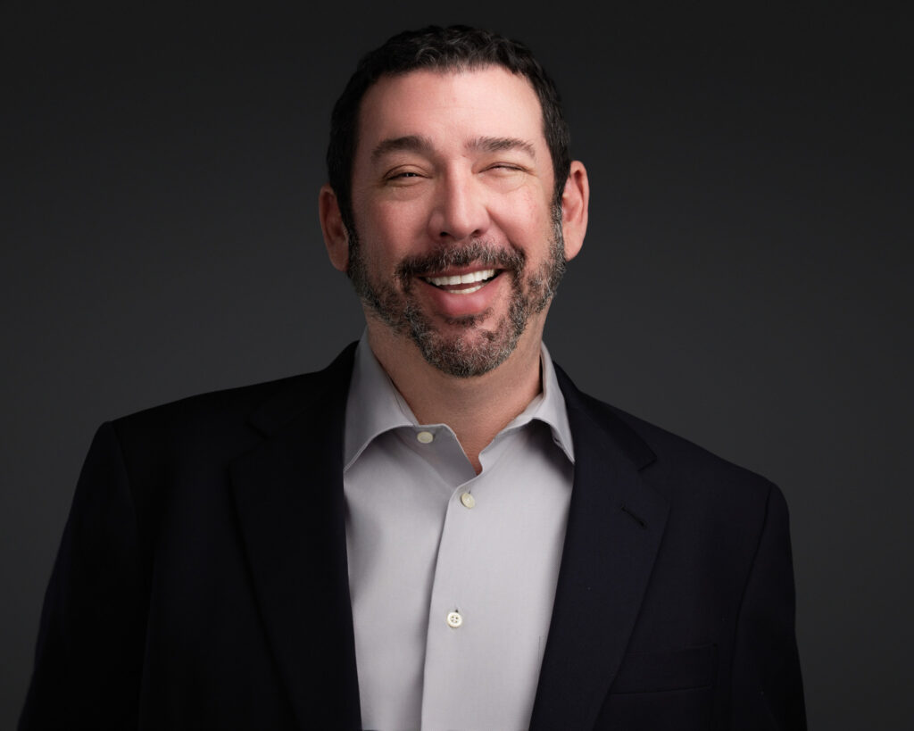 An image of a man having a fun time getting headshots
