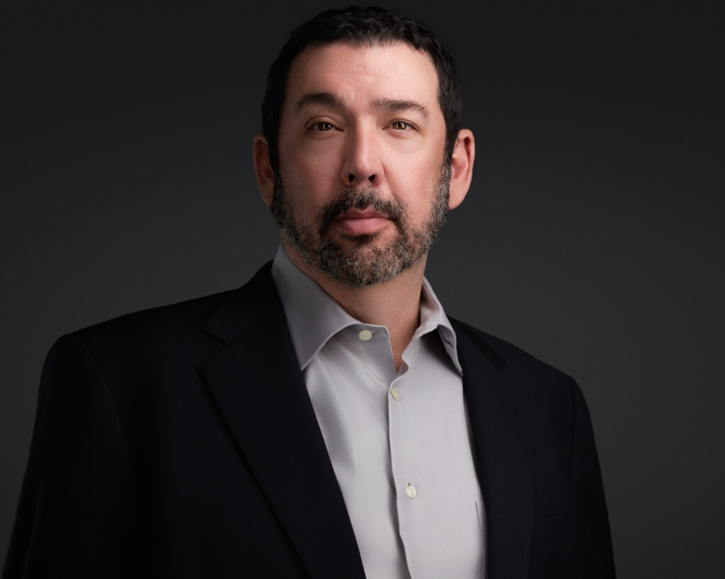 A serious headshot image